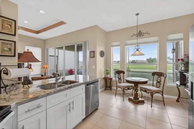a bathroom with a sink a toilet a mirror and shower