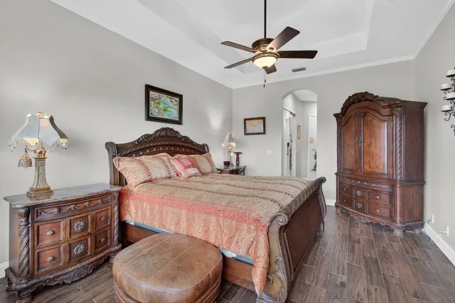 an aerial view of residential houses with outdoor space and swimming pool