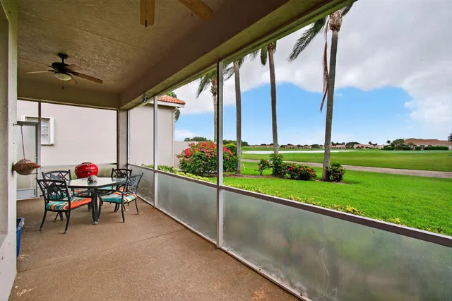 a room with furniture and a large window