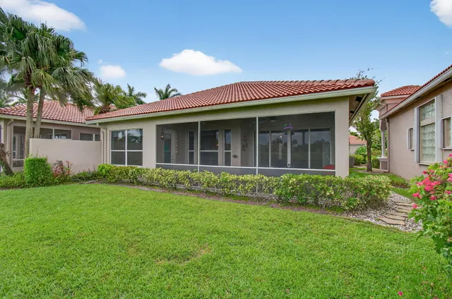 a front view of a house with a yard table and chairs