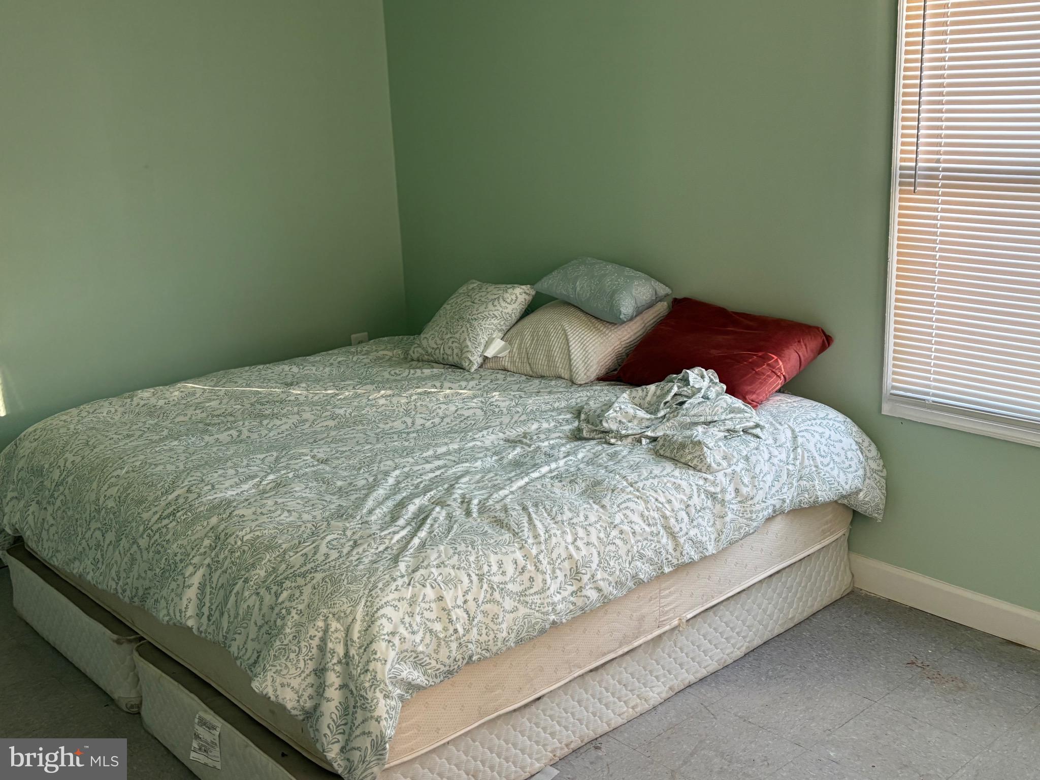 5312 Tabler Station Road Inwood, WV 25428 - Photo 28 of 37 a bed sitting in a bedroom next to a window