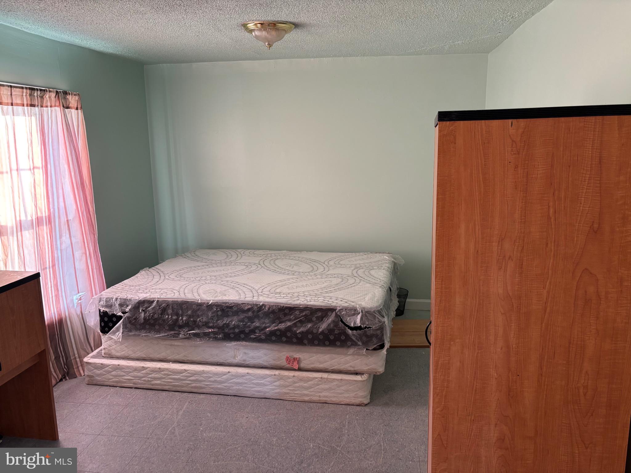 5312 Tabler Station Road Inwood, WV 25428 - Photo 32 of 37 a bedroom with a bed and a window