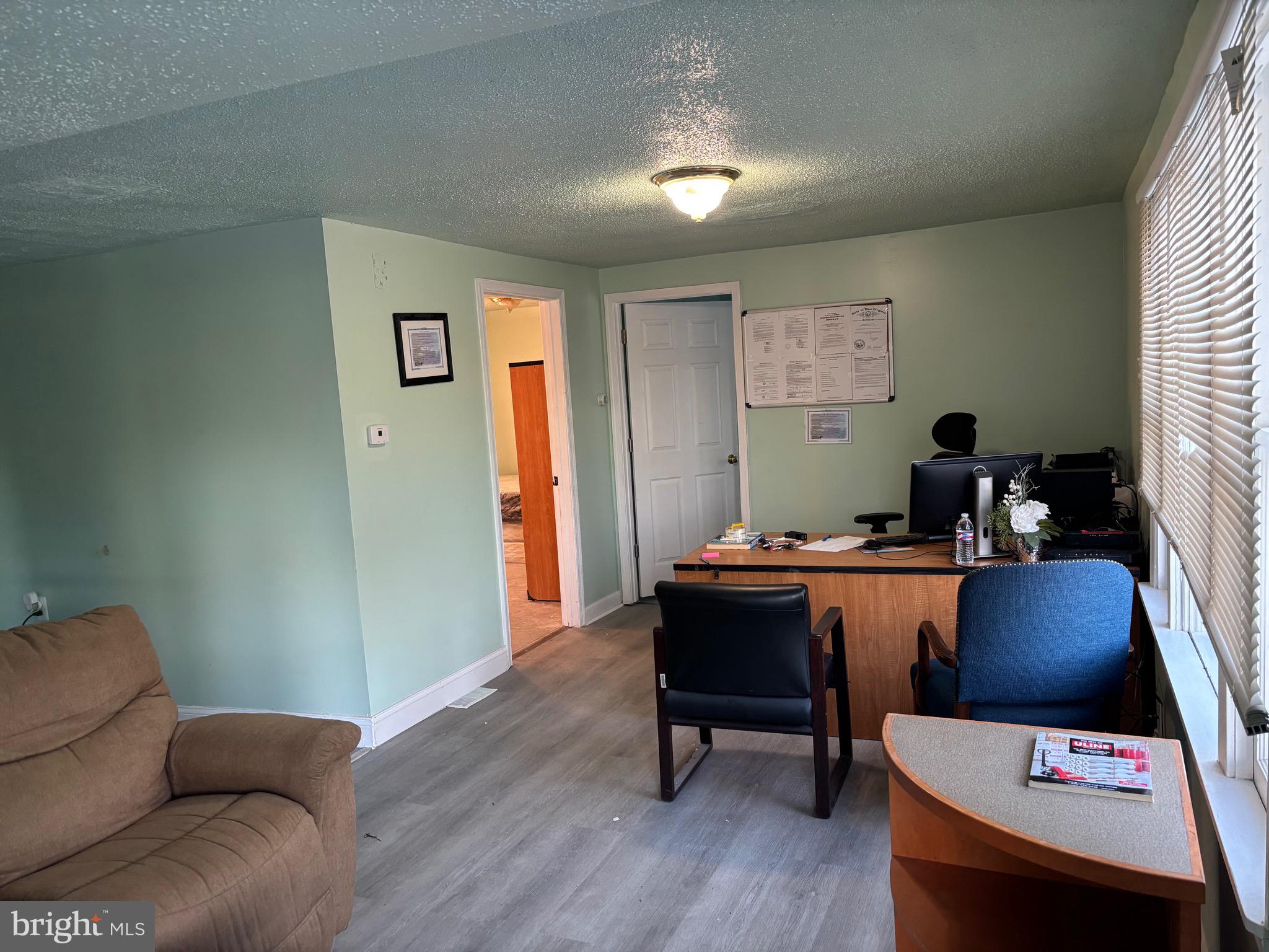 5312 Tabler Station Road Inwood, WV 25428 - Photo 33 of 37 a workspace with furniture and wooden floor