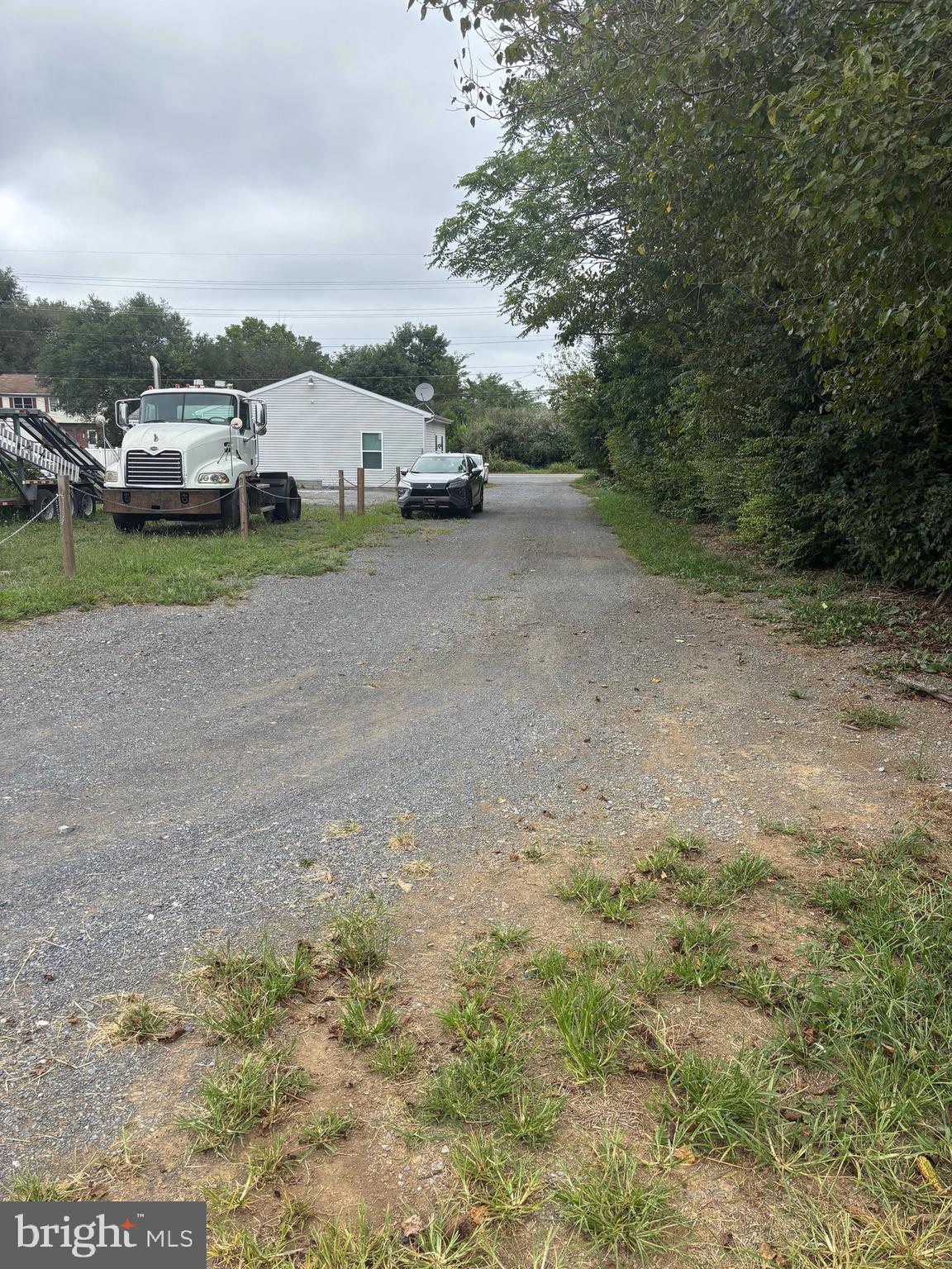 5312 Tabler Station Road Inwood, WV 25428 - Photo 34 of 37 a view of a yard with car parked