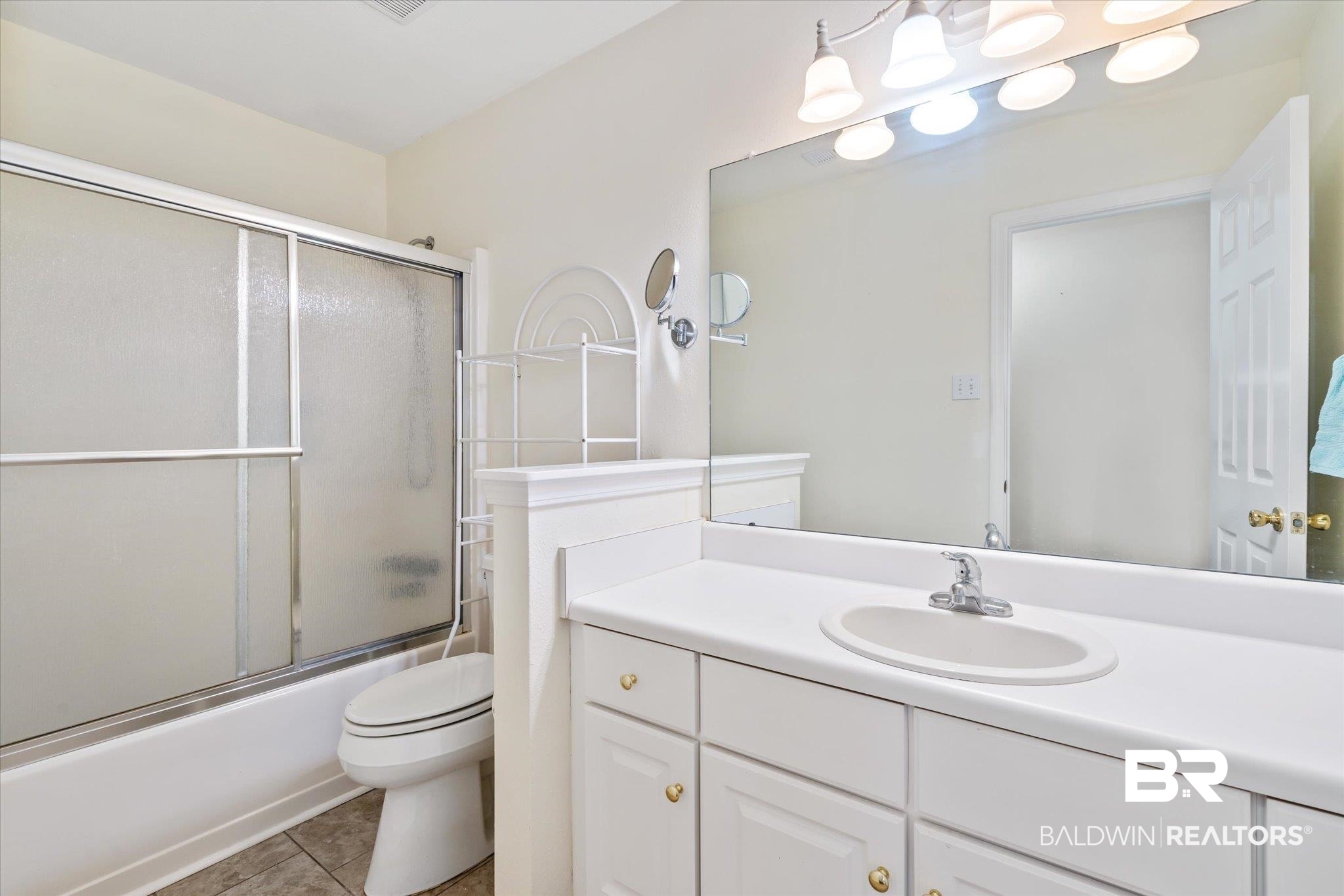7236 Highpointe Place East Daphne, AL 36527 - Photo 21 of 32 Full bathroom with tile patterned flooring, toilet, combined bath / shower with glass door, and vanity