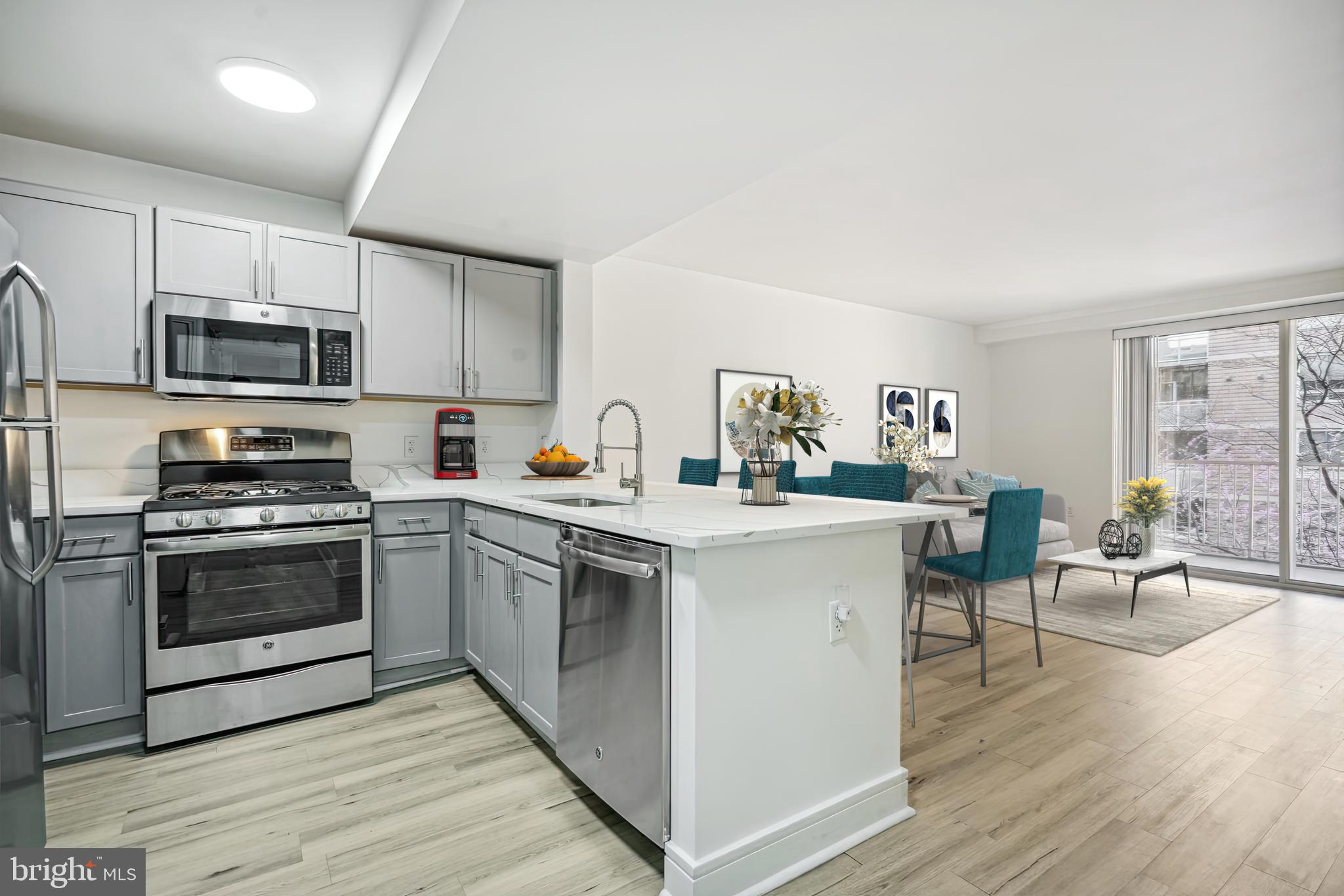 800 4th Street Southwest, Unit S120 Washington, DC 20024 - Photo 2 of 20 Kitchen: Quartz counters with a peninsula .