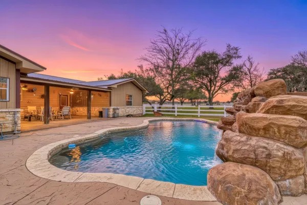 a view of a house with swimming pool