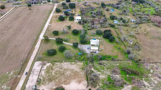 an aerial view of residential houses with outdoor space