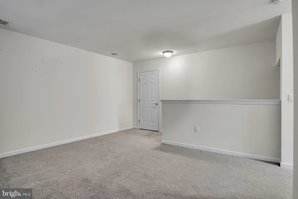 a view of a living room with wooden floor