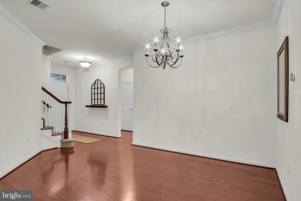 a kitchen with stainless steel appliances granite countertop a sink a refrigerator and a stove