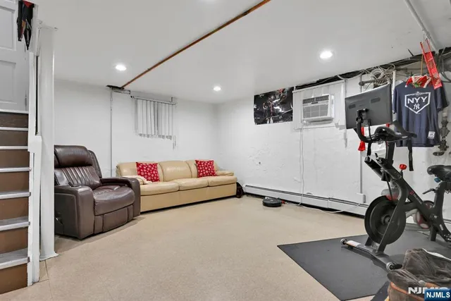 a room with furniture and gym equipment