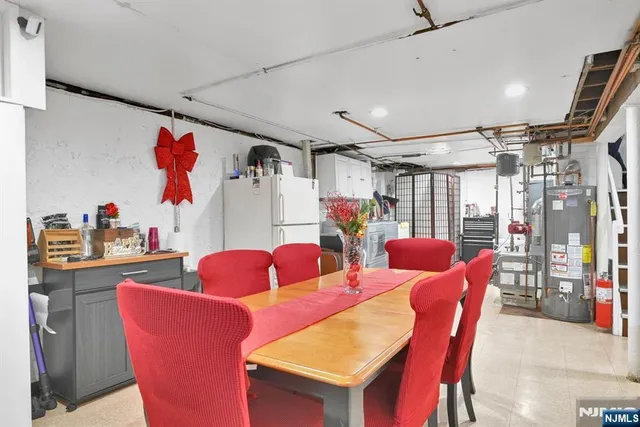 a outdoor dining space with furniture and a chandelier