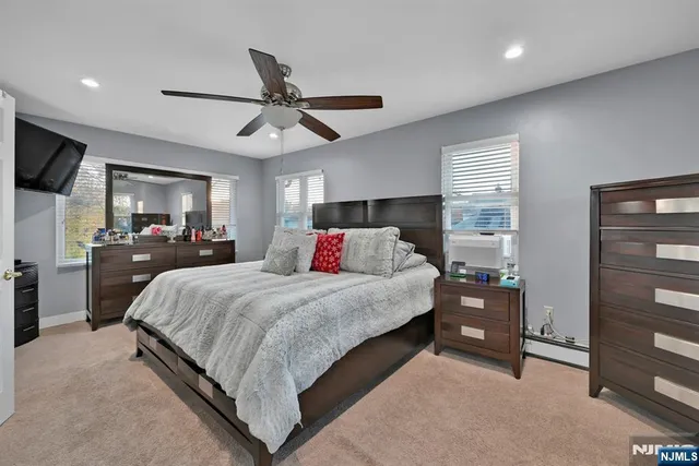 a bed room with a bed and a tv