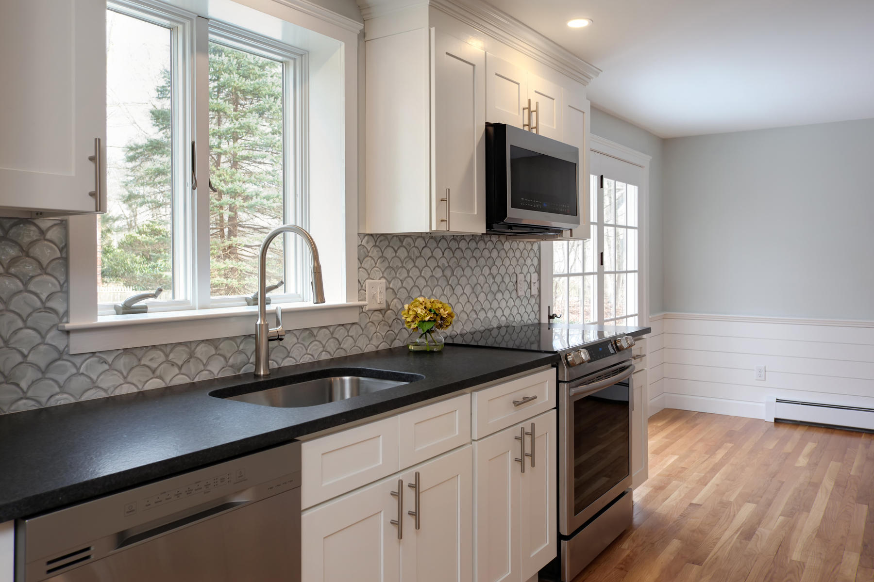 45 Chipman Road Sandwich, MA 02563 - Photo 8 of 30 a kitchen with stainless steel appliances a sink a stove and a window