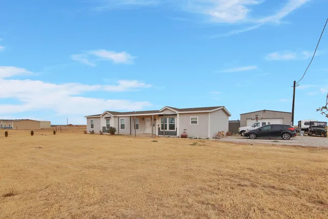 a view of a house with a ocean view