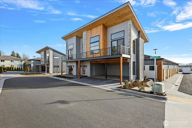 a front view of a building with parking