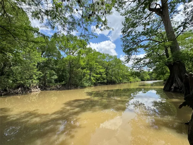 a view of lake with green space