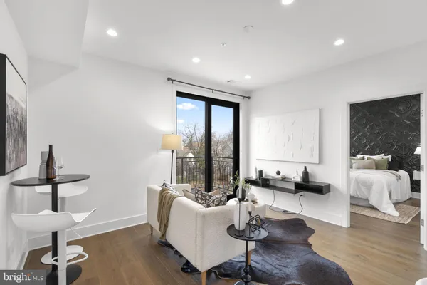 a living room with furniture or couch and a large window