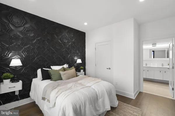 a bedroom with a bed and a view of bedroom