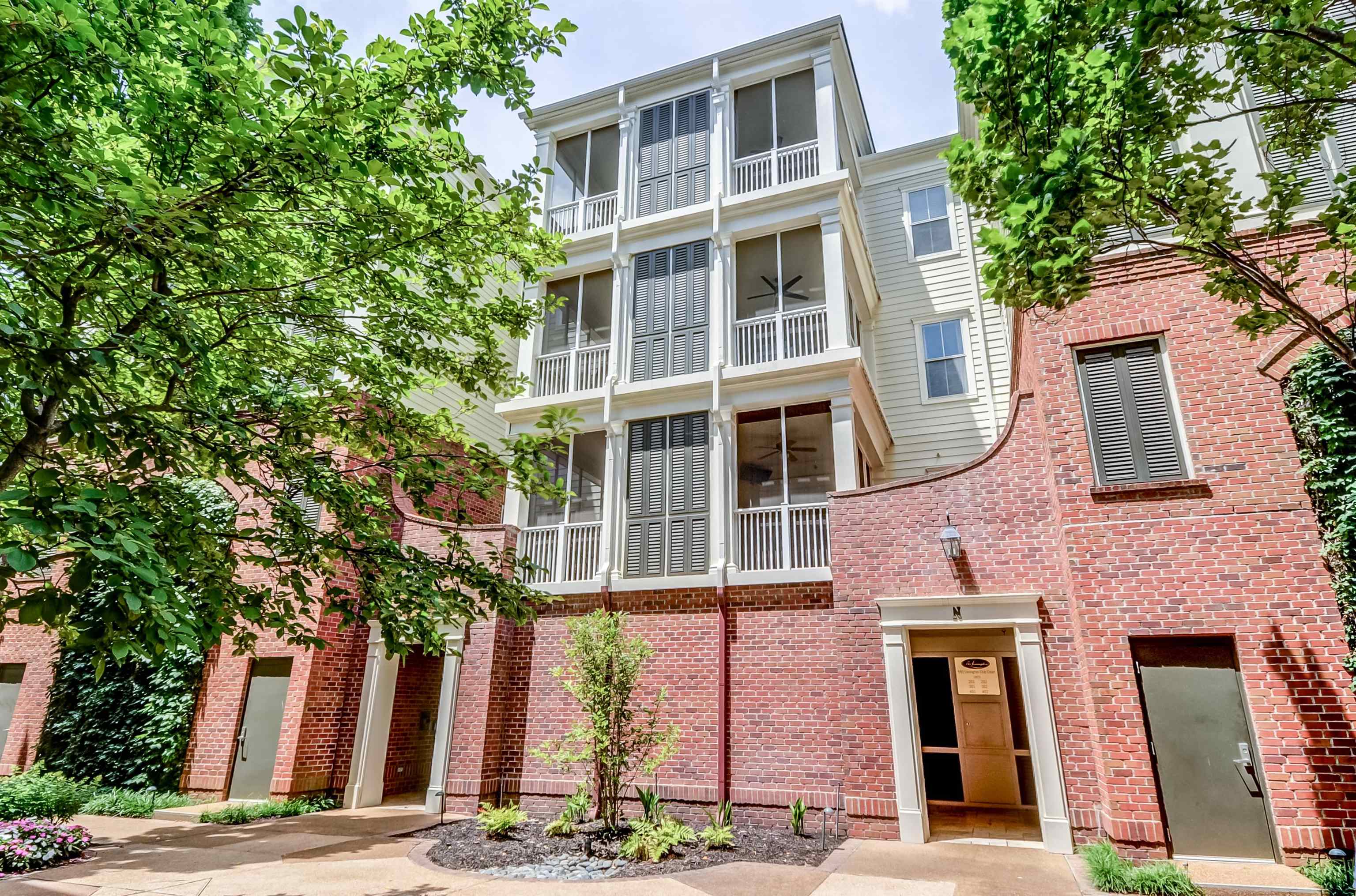 591 Lexington Road, Unit 303 Memphis, TN 38117 - Photo 3 of 34 a front view of a multi story building with a yard