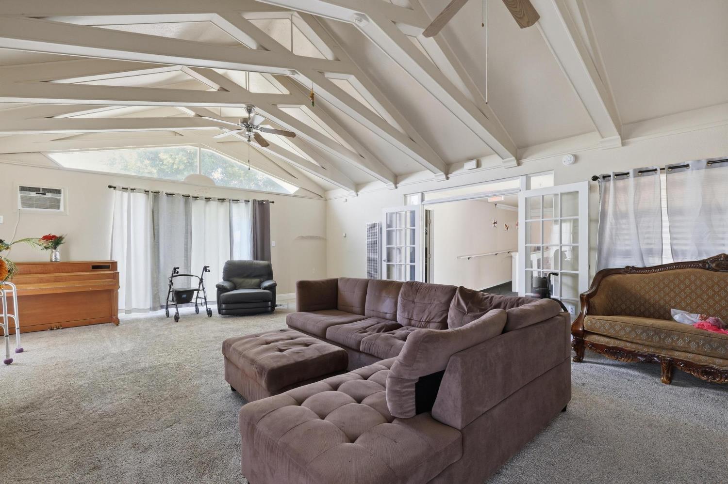 920 Bogue Road Yuba City, CA 95991 - Photo 13 of 26 Huge family room with french doors to the wide hallway