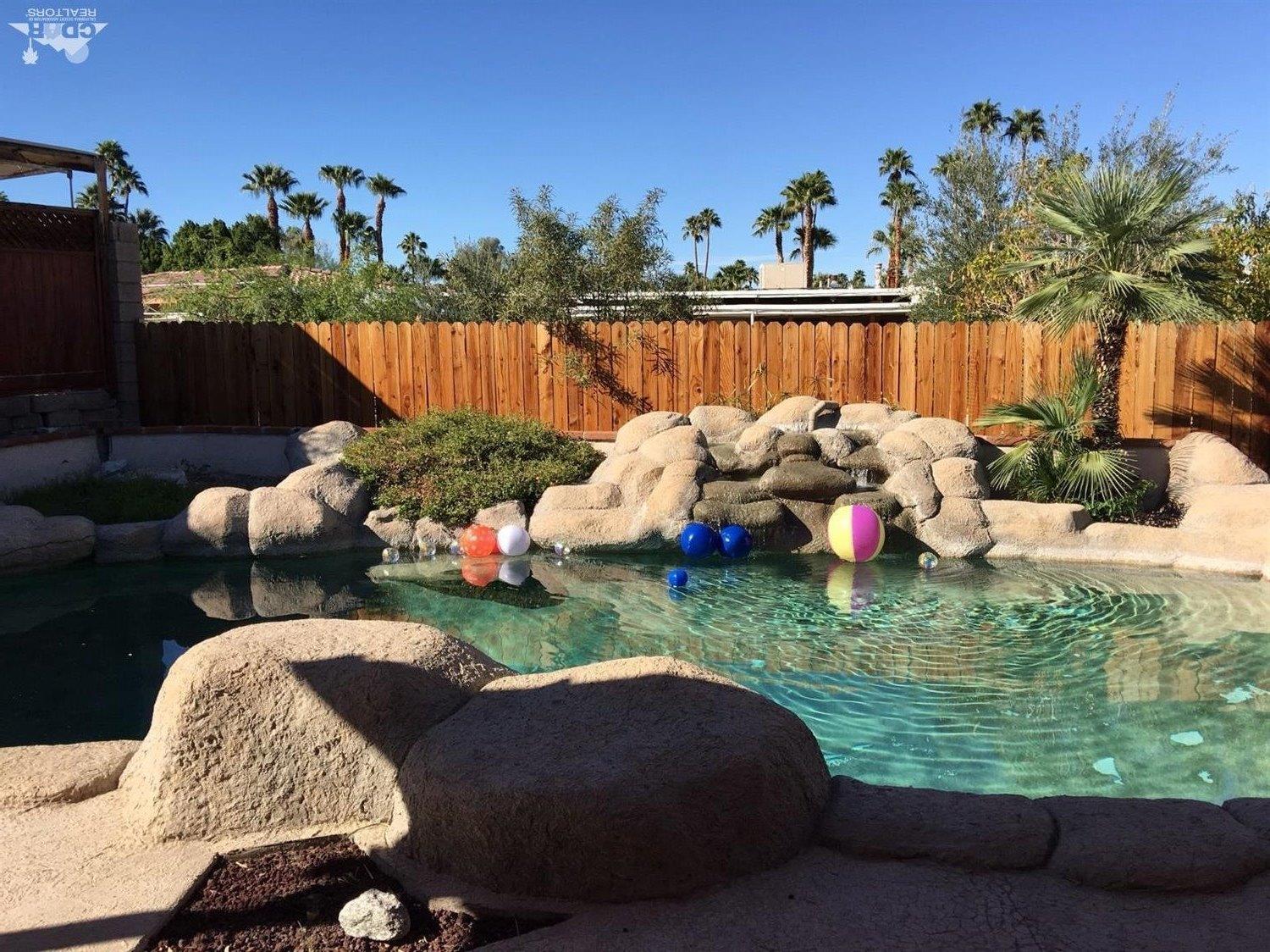 42637 East Veldt Street Rancho Mirage, CA 92270 - Photo 1 of 11 a front view of a house with deck and outdoor seating