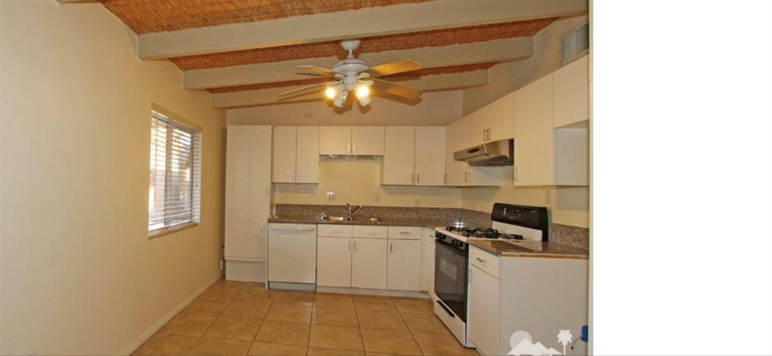 42637 East Veldt Street Rancho Mirage, CA 92270 - Photo 4 of 11 a kitchen with cabinets a sink and appliances