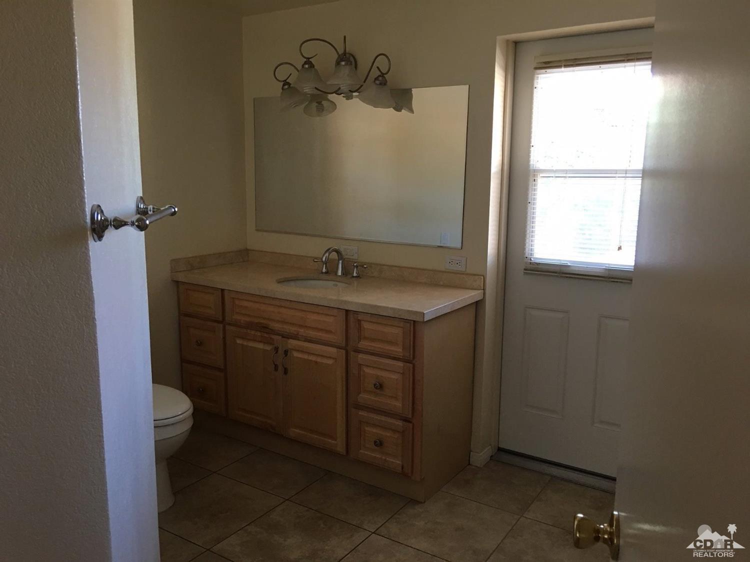 42637 East Veldt Street Rancho Mirage, CA 92270 - Photo 9 of 11 a bathroom with a sink and a vanity
