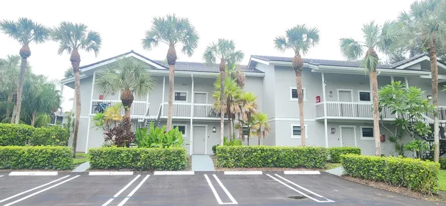 an aerial view of a house with a swimming pool