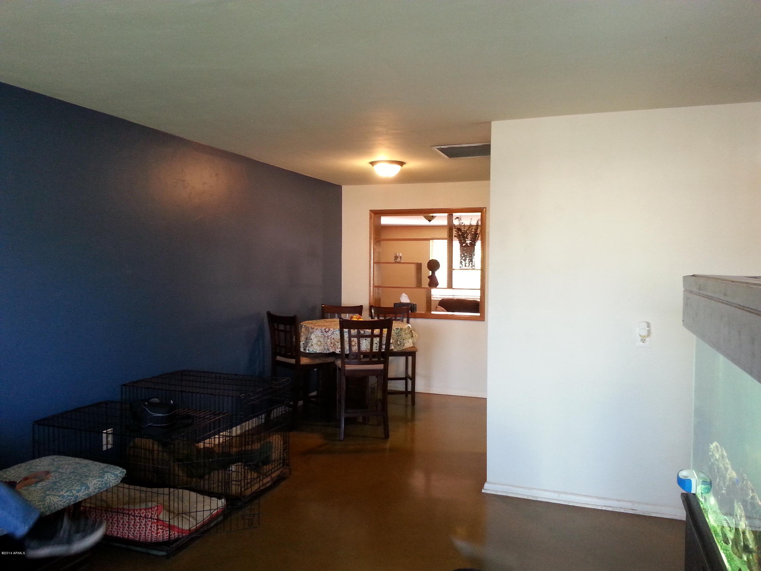 3337 East Granada Road Phoenix, AZ 85008 - Photo 3 of 22 a living room with furniture and wooden floor