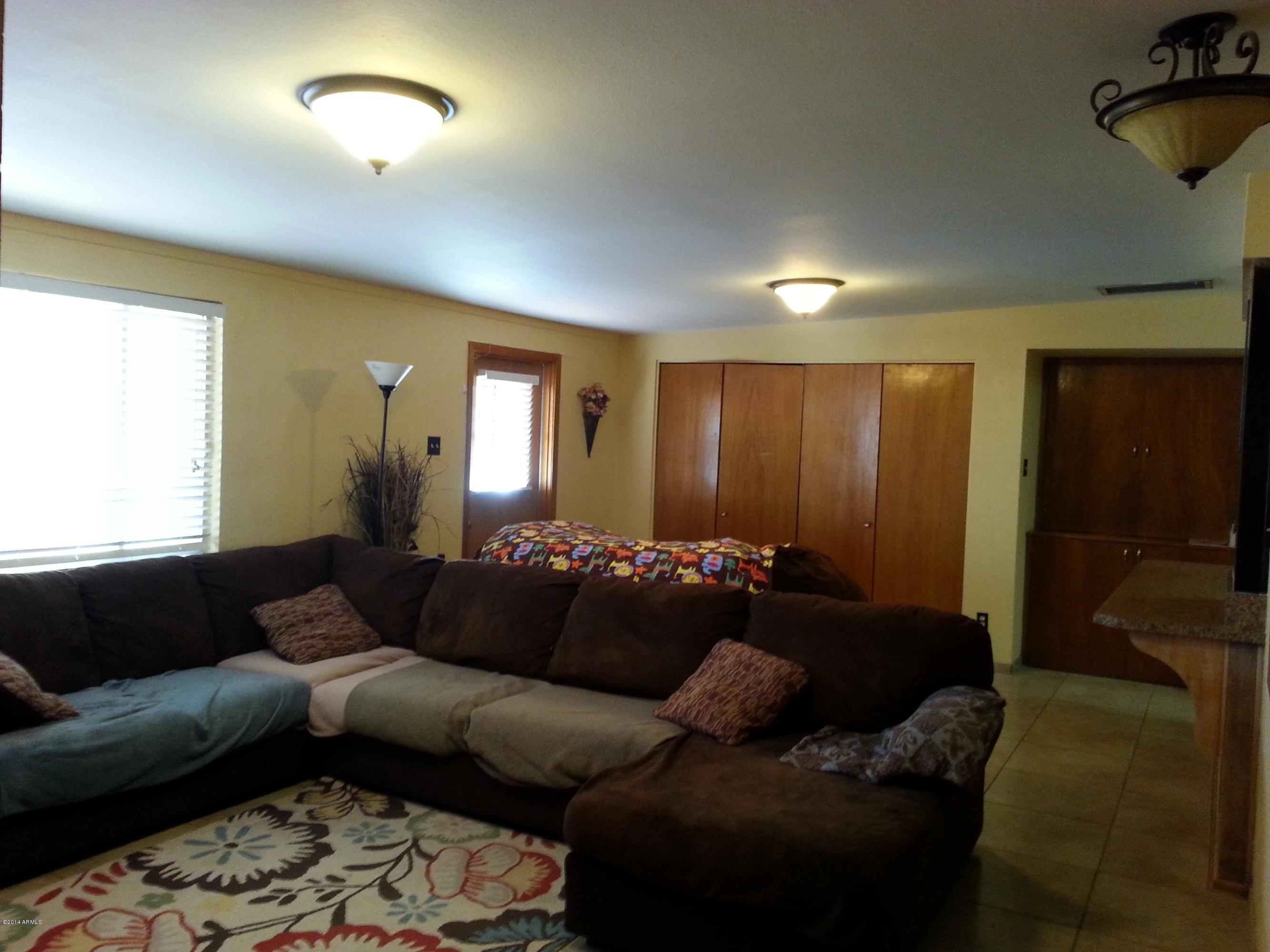 3337 East Granada Road Phoenix, AZ 85008 - Photo 8 of 22 a living room with furniture and a couch