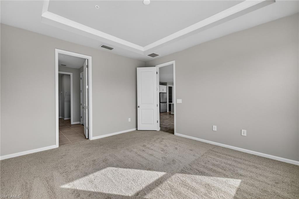 4646 Arboretum Circle, Unit 201 Naples, FL 34112 - Photo 17 of 26 Master Bedroom