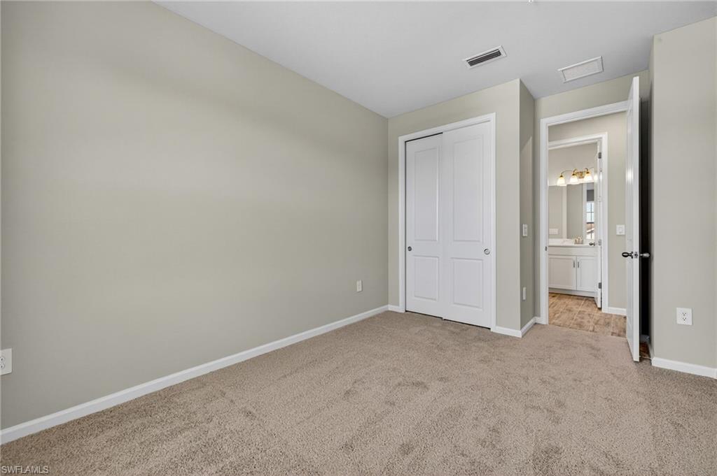 4646 Arboretum Circle, Unit 201 Naples, FL 34112 - Photo 21 of 26 Guest Bedroom