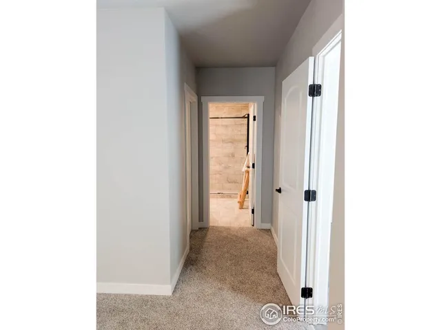 a view of a room with a white walls