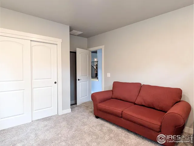 a blue couch sitting in a living room