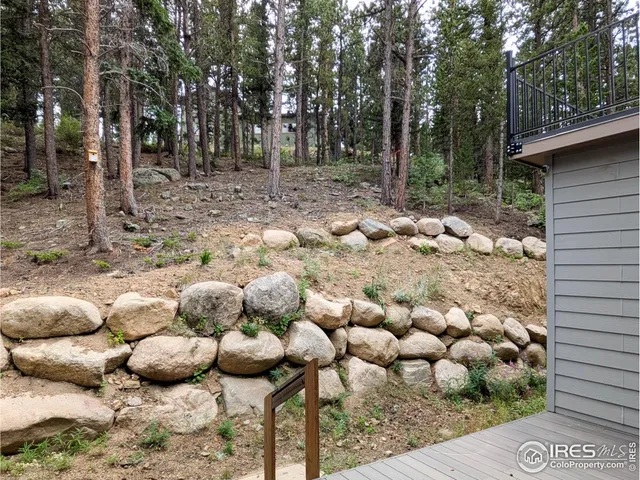 a front view of a house with a yard covered in snow