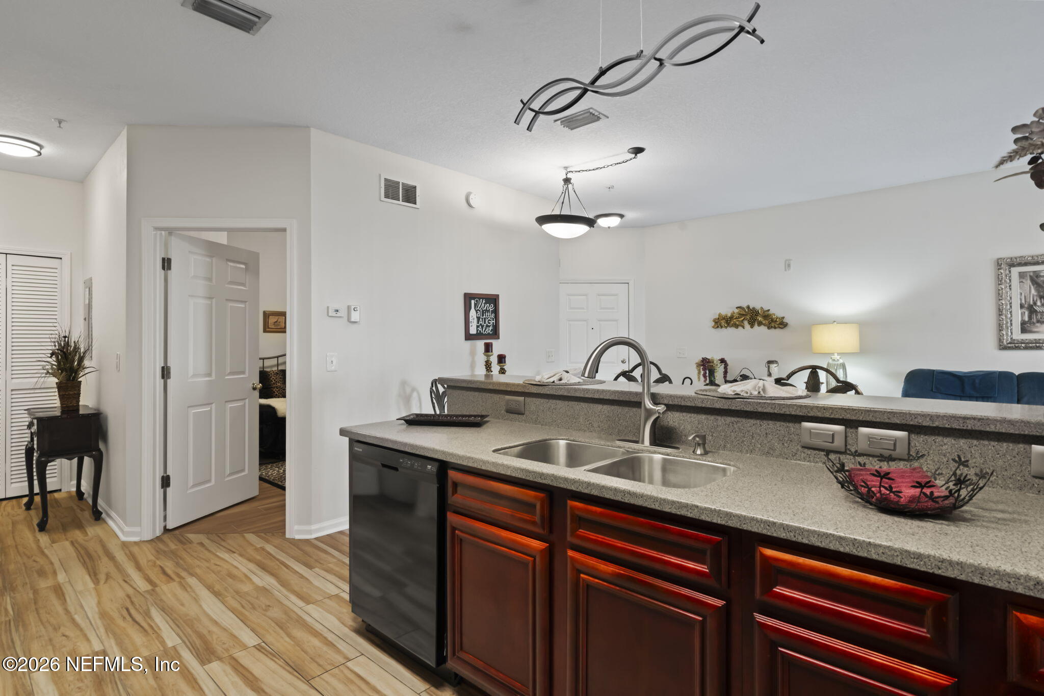 8218 Green Parrot Road, Unit 105 Jacksonville, FL 32256 - Photo 13 of 42 a kitchen with a sink and cabinets