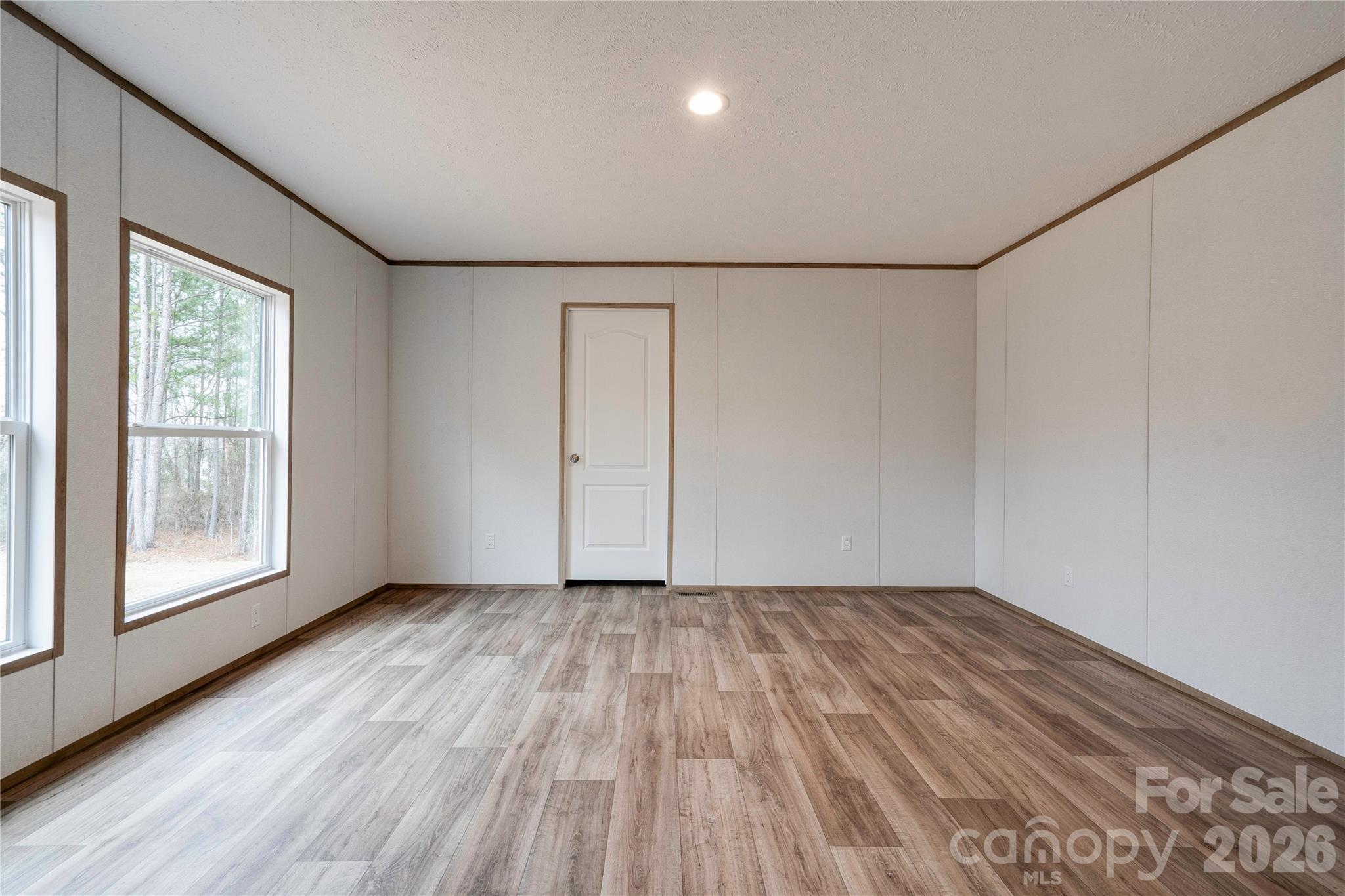 1249 Cleveland Avenue Grover, NC 28073 - Photo 17 of 34 wooden floor in an empty room with a window
