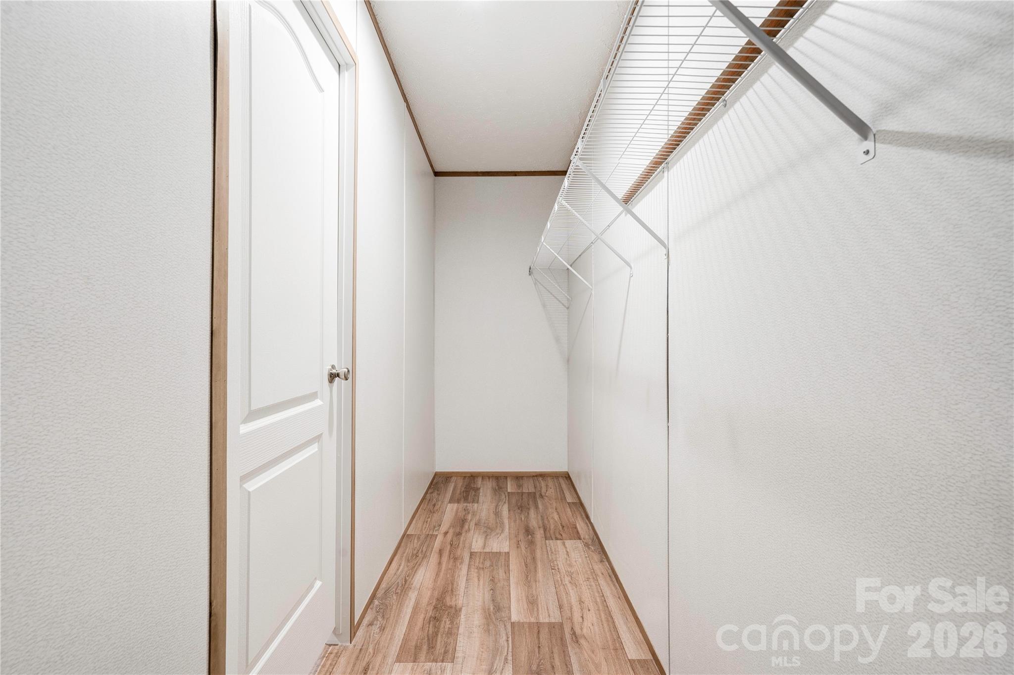 1249 Cleveland Avenue Grover, NC 28073 - Photo 19 of 34 a view of a hallway with wooden floor and entryway