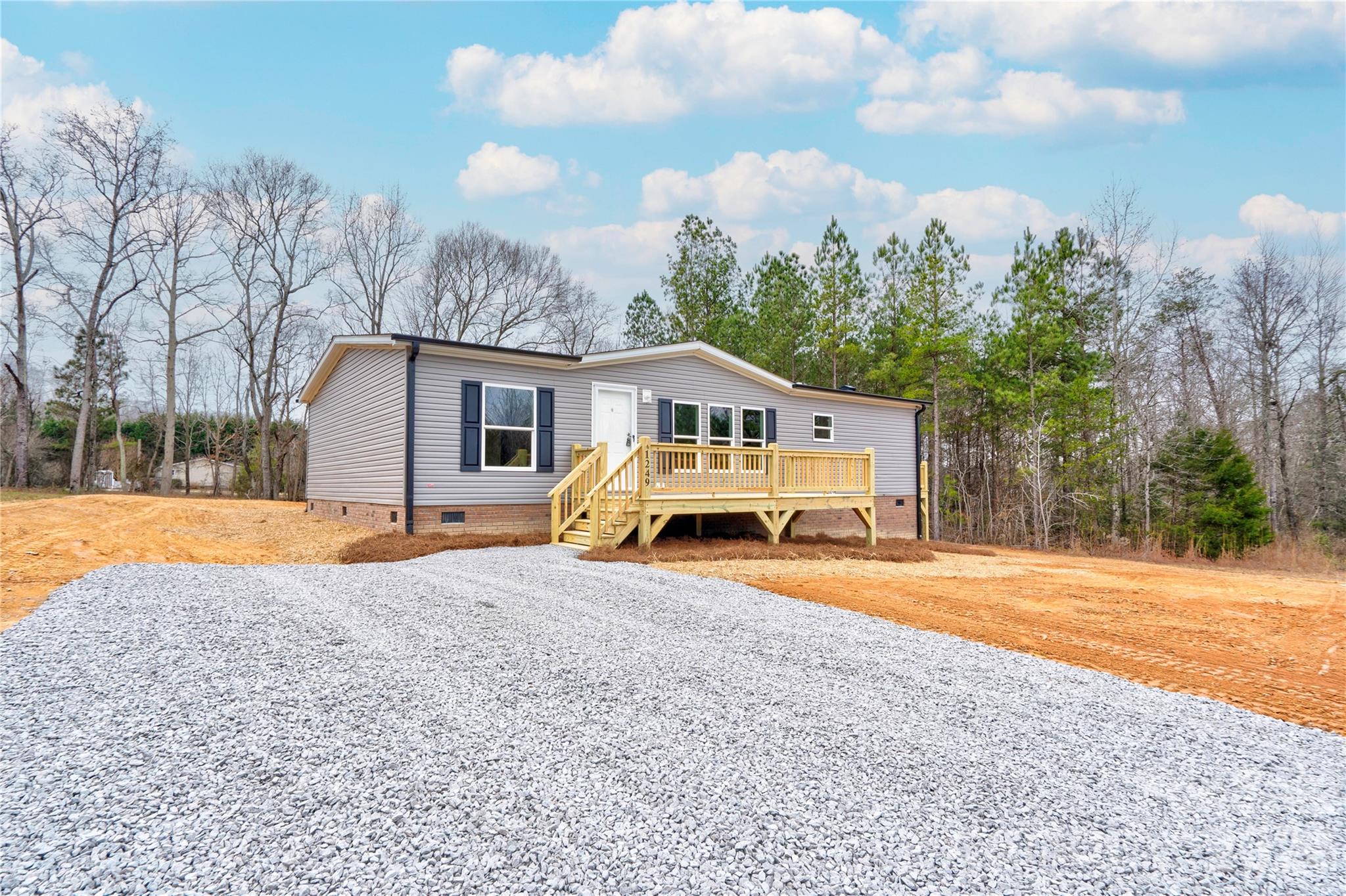 1249 Cleveland Avenue Grover, NC 28073 - Photo 2 of 34 a view of house with backyard and trees