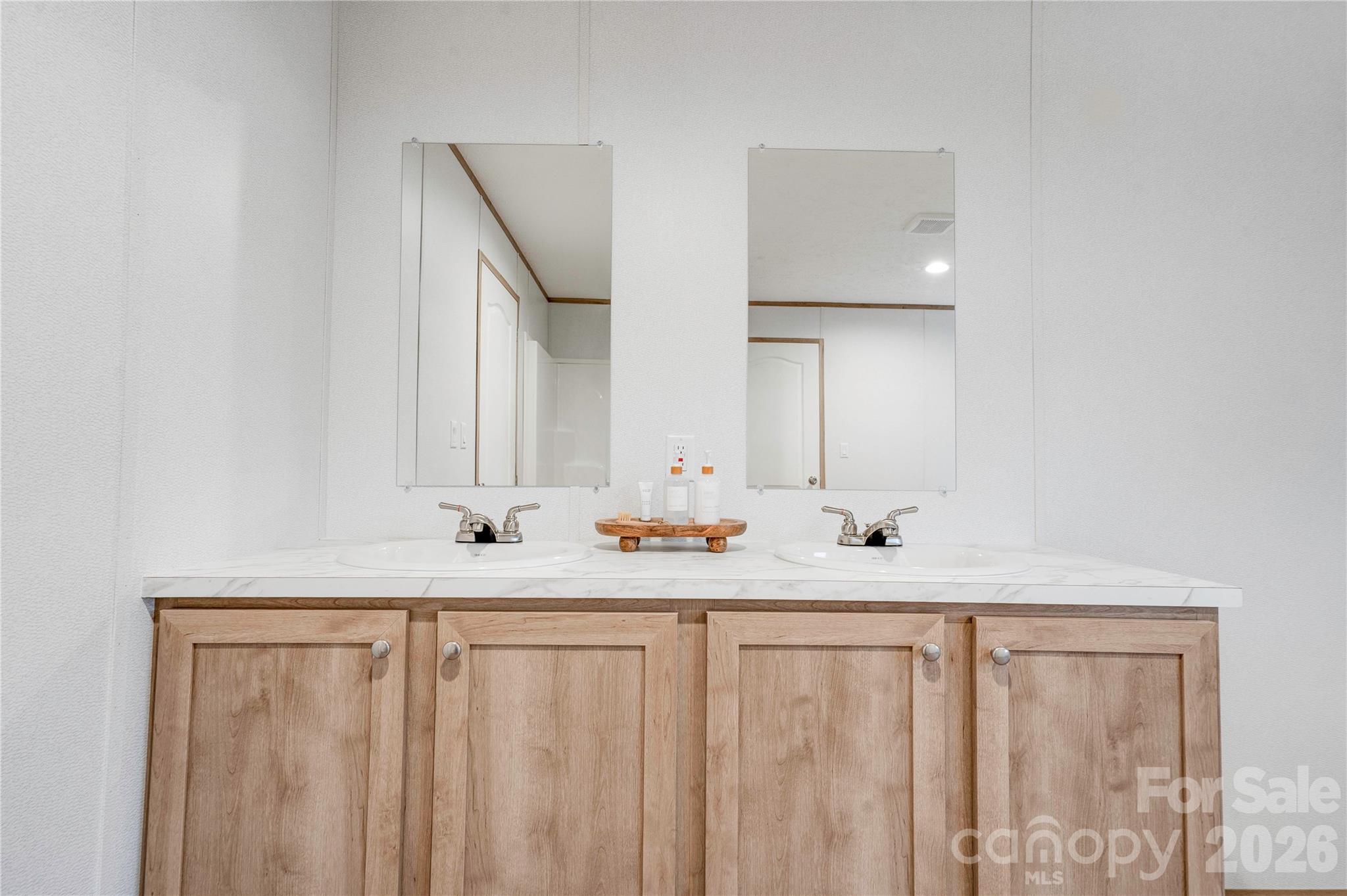1249 Cleveland Avenue Grover, NC 28073 - Photo 21 of 34 a bathroom with 2 sink and a mirror