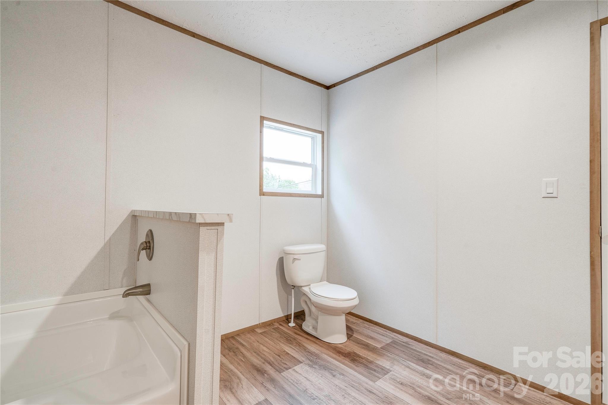 1249 Cleveland Avenue Grover, NC 28073 - Photo 23 of 34 a bathroom with a toilet and a shower