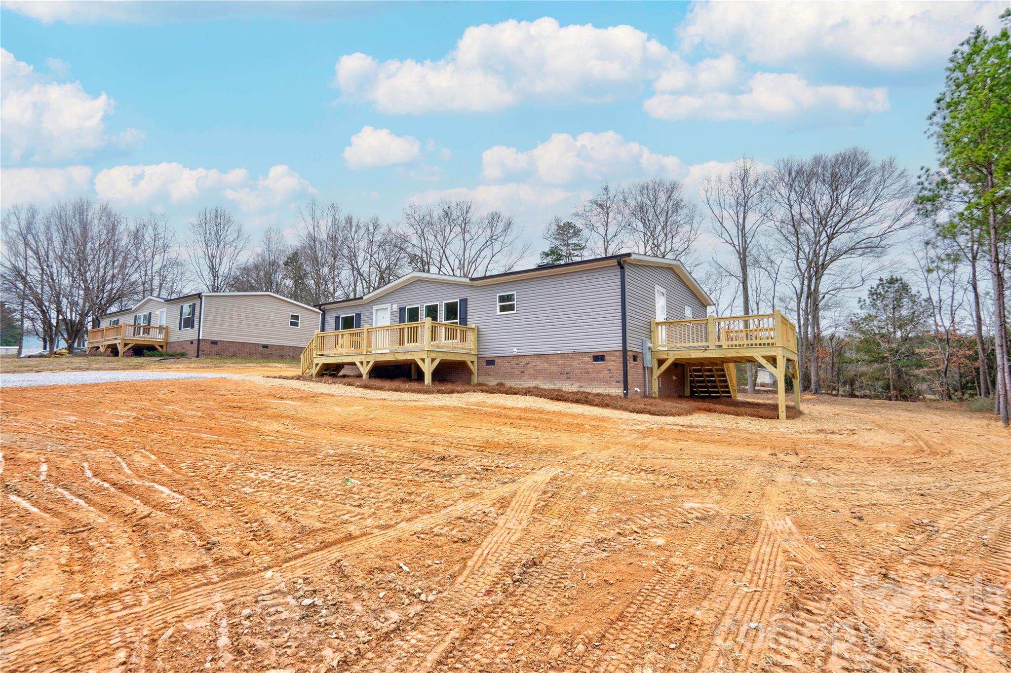 1249 Cleveland Avenue Grover, NC 28073 - Photo 4 of 34 a view of a house with snow on the background