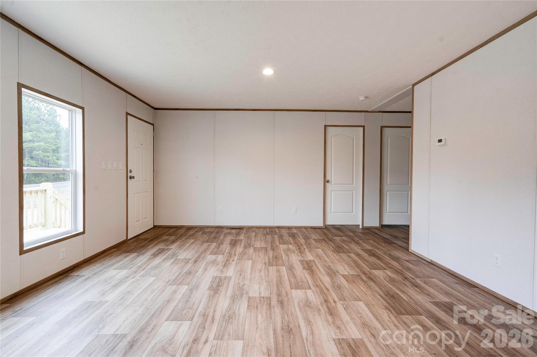 1249 Cleveland Avenue Grover, NC 28073 - Photo 6 of 34 a view of empty room with wooden floor and fan