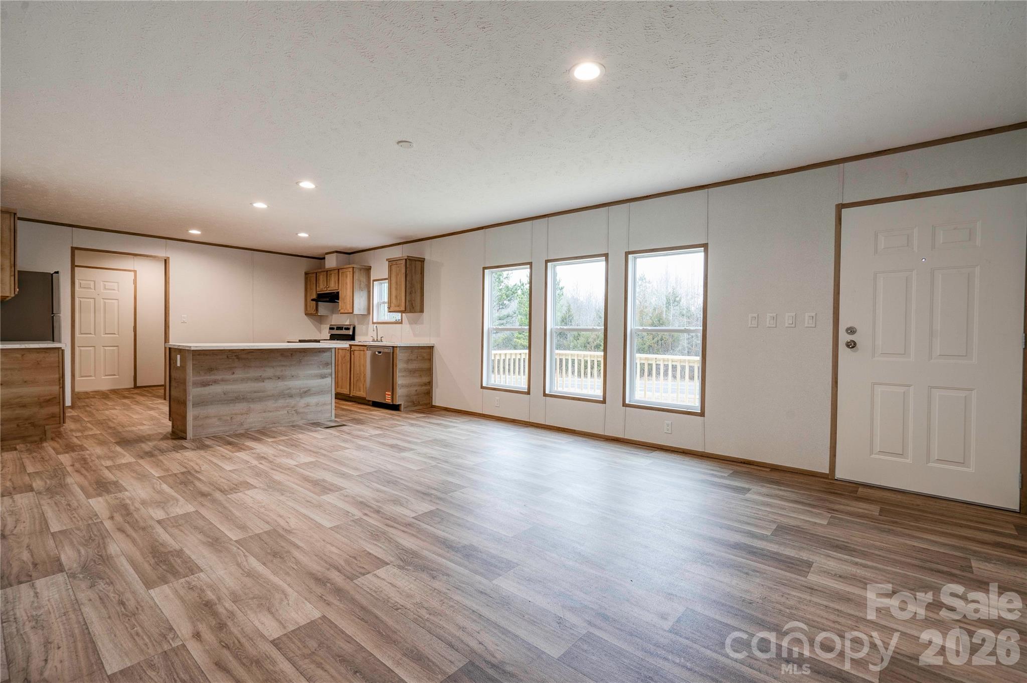 1249 Cleveland Avenue Grover, NC 28073 - Photo 7 of 34 a view of empty room with wooden floor and window