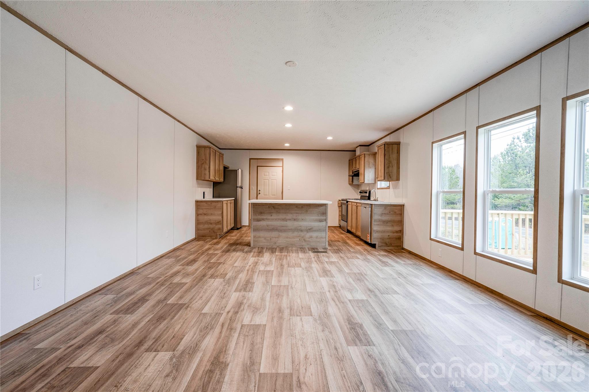 1249 Cleveland Avenue Grover, NC 28073 - Photo 8 of 34 a big room with wooden floor and windows