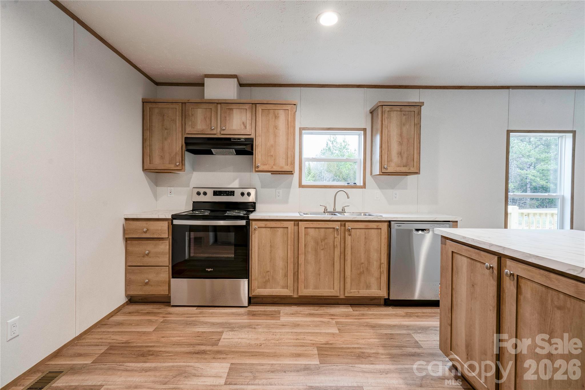 1249 Cleveland Avenue Grover, NC 28073 - Photo 10 of 34 a kitchen with granite countertop a stove and a sink