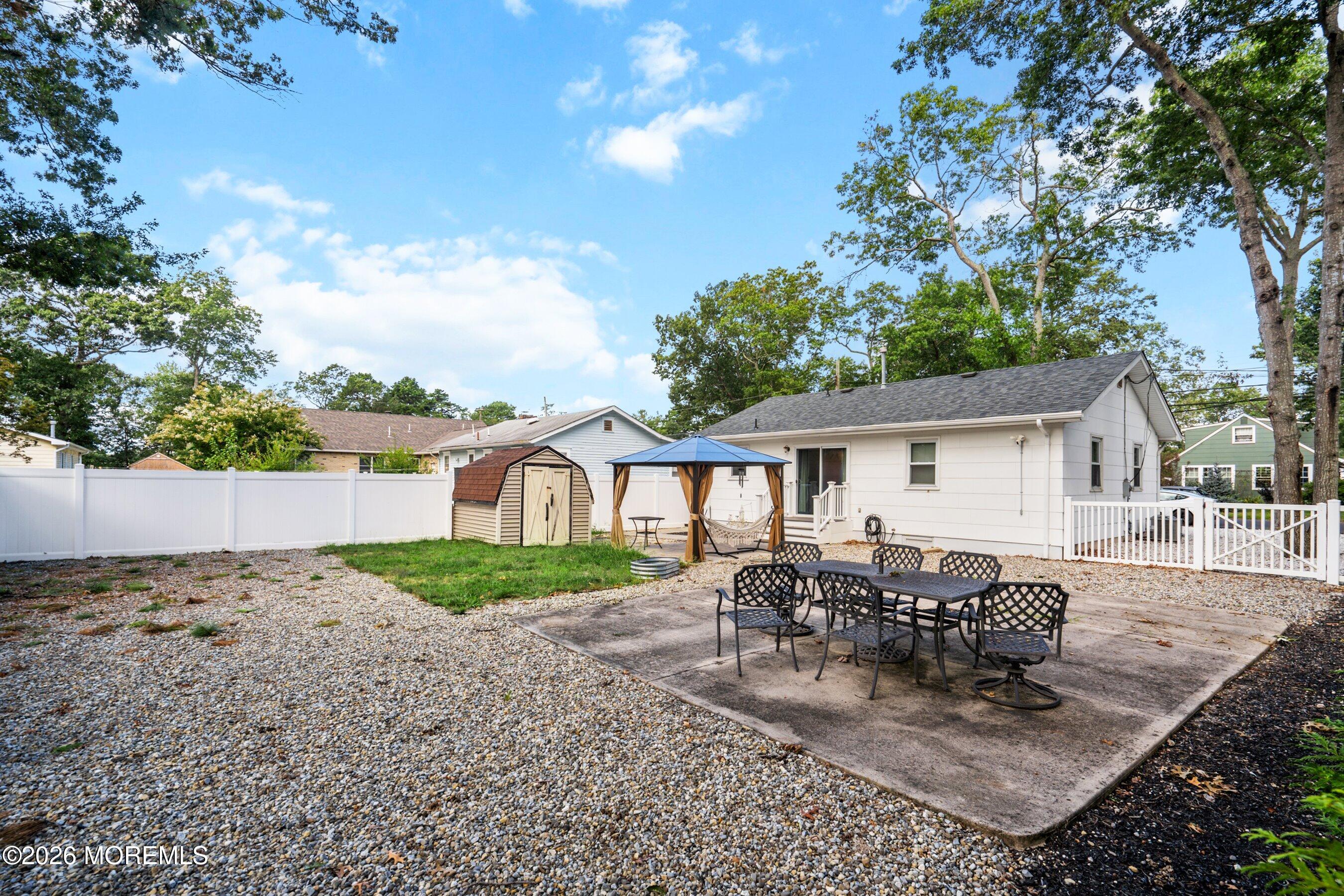 329 Briggs Avenue Forked River, NJ 08731 - Photo 16 of 16 a view of a house with a patio