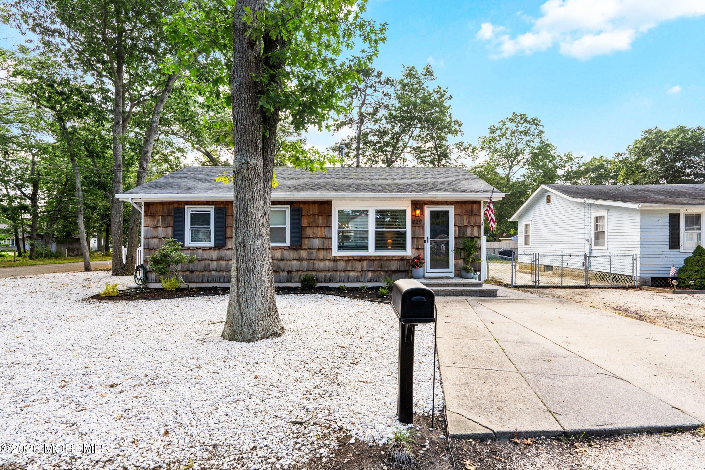 329 Briggs Avenue Forked River, NJ 08731 - Photo 2 of 16 front view of a house with a patio