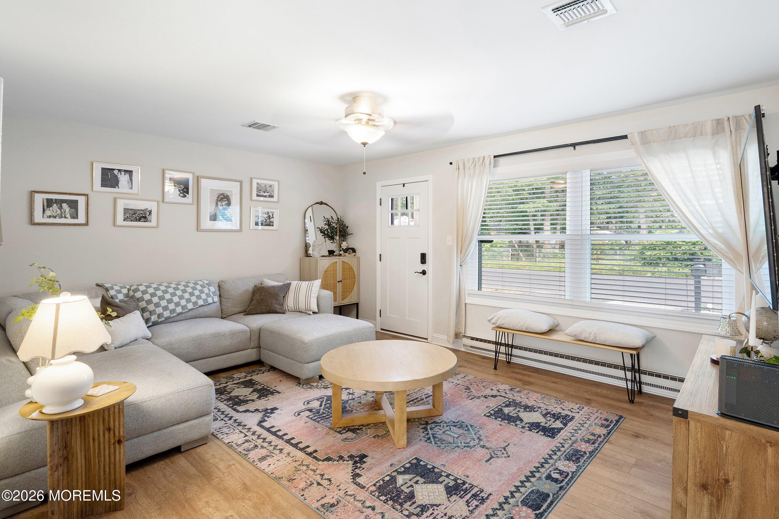 329 Briggs Avenue Forked River, NJ 08731 - Photo 3 of 16 a living room with furniture and a large window